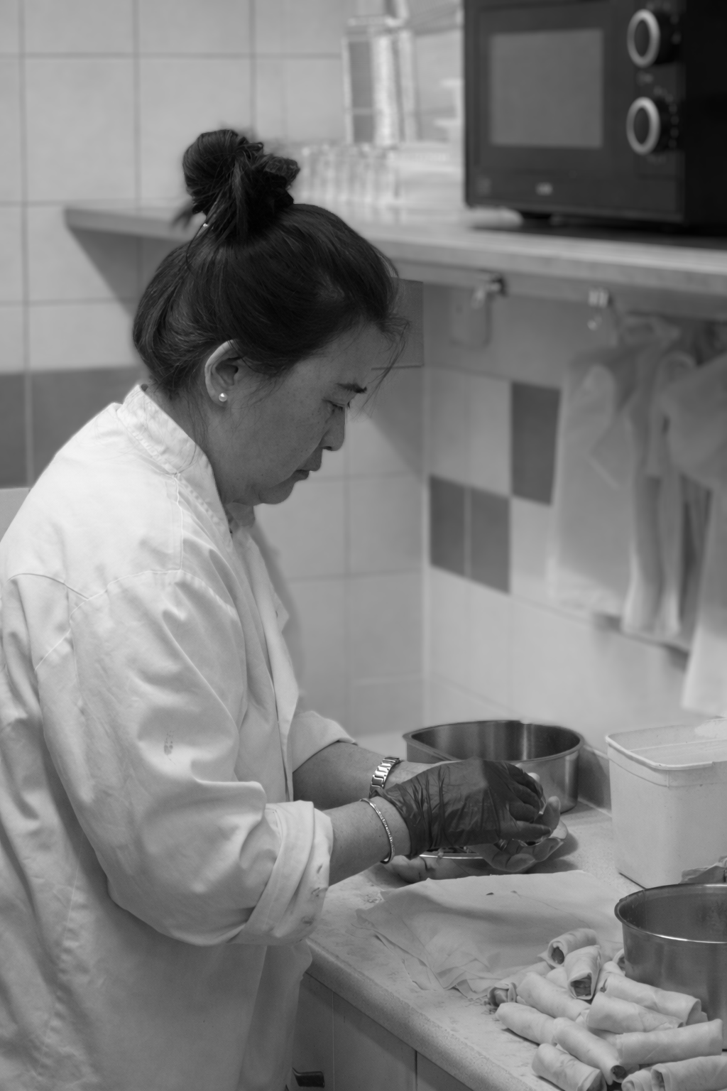 Queenie preparing food in the kitchen